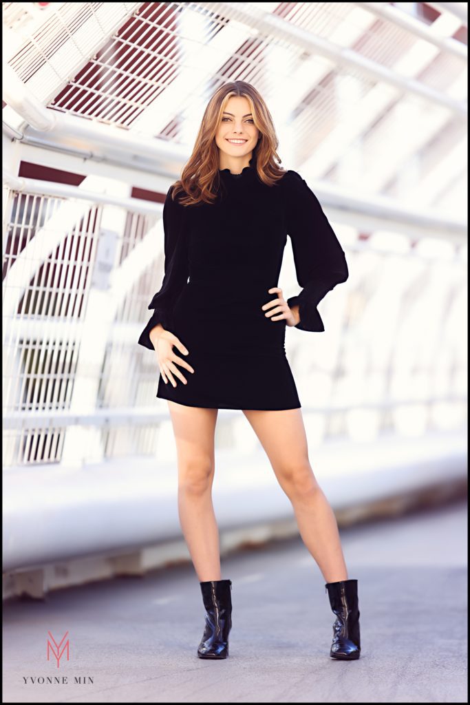 Emma poses for her senior photos on the top of the Millennium Bridge in Denver, Colorado.