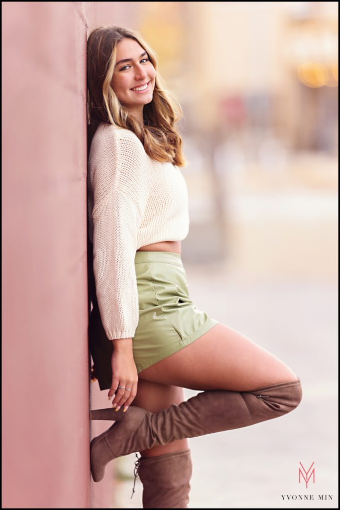 Maddie leans against a wall during her senior photoshoot that took place in Westminster, Colorado. 