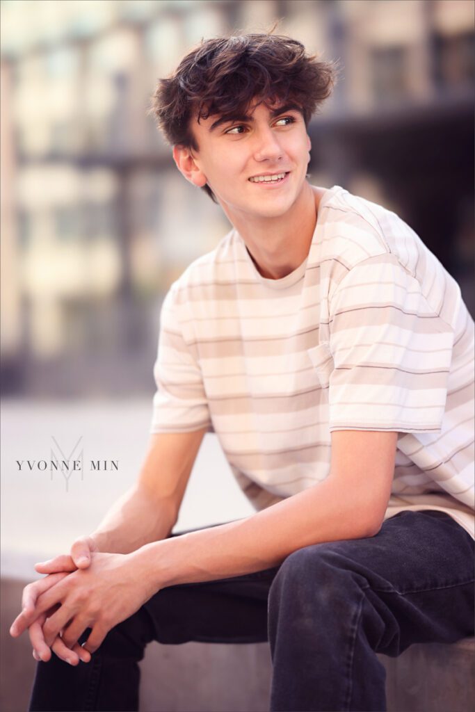 A high school senior from Erie High School in Colorado looks off into the distance during his senior photoshoot.