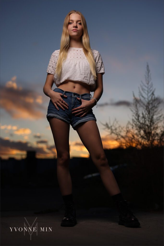 An OCF senior photograph of a Mountain Range High School senior girl taken in the RiNo district of downtown Denver by Yvonne Min Photography.