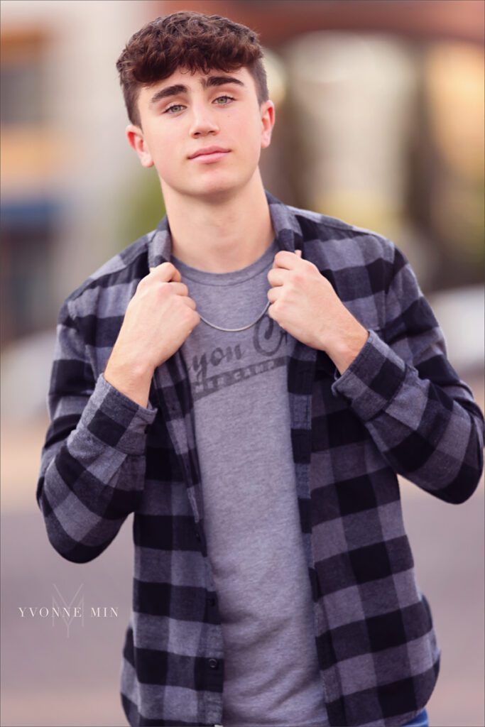 A picture of a senior boy from Stargate High School from his senior photoshoot in the RiNo Art District in downtown Denver with Yvonne Min Photography.