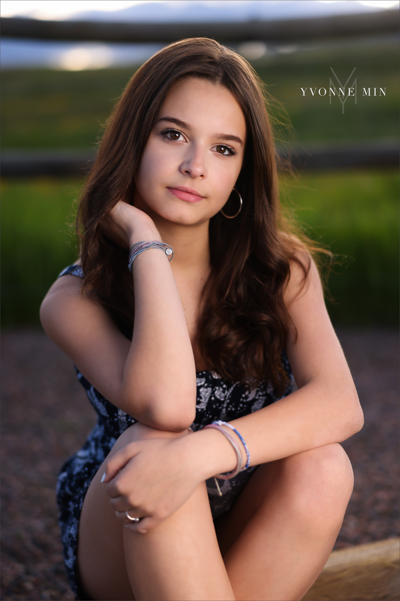 An OCF senior photo of a Stargate High School girl taken at Flatirons Vista outside Boulder, Colorado by Yvonne Min Photography.