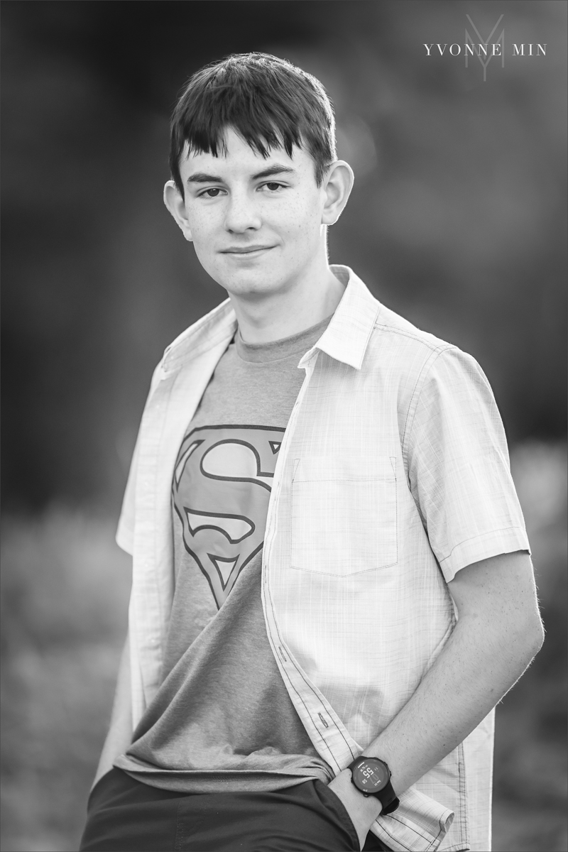 A black and white photograph of a Stargate High School senior guy taken at Artisit's Point in Boulder, Colorado by Yvonne Min Photography.