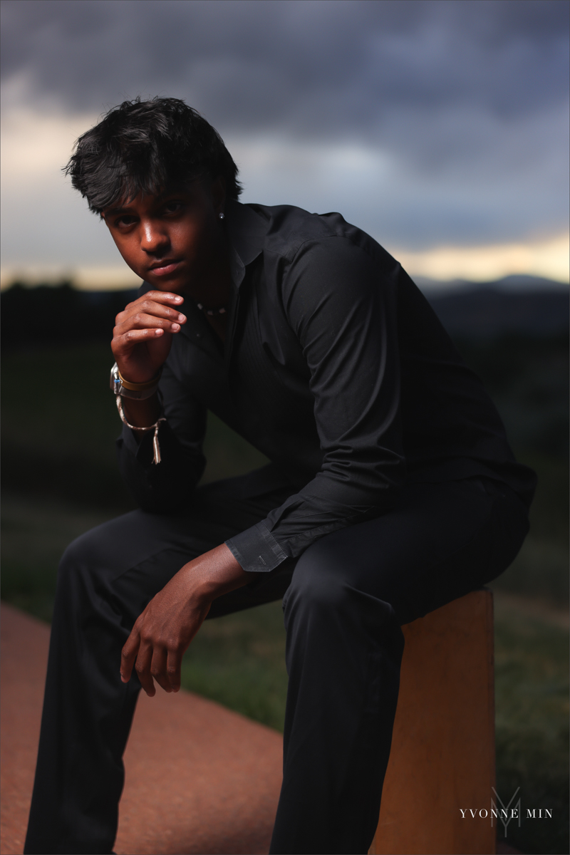 An OCF photograph of a high school senior boy from Stargate High School taken in Majestic Views Park, Arvada by Yvonne Min Photography.