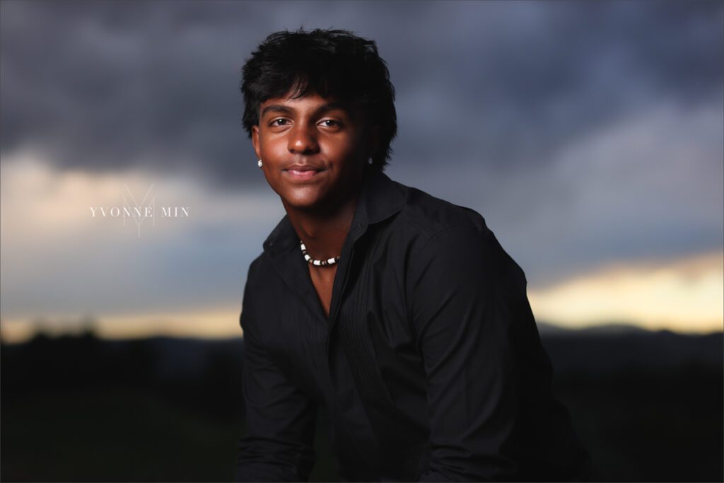 An OCF photograph of a high school senior boy from Stargate High School taken in Majestic Views Park, Arvada by Yvonne Min Photography.