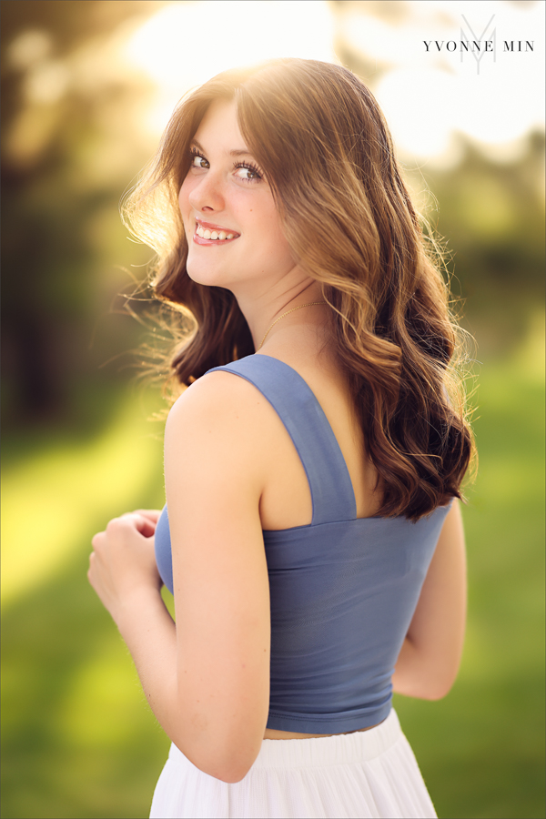 A senior picture of a Stargate High School girl taken at sunset in Purple Park, Superior, Colorado by Yvonne Min Photography.