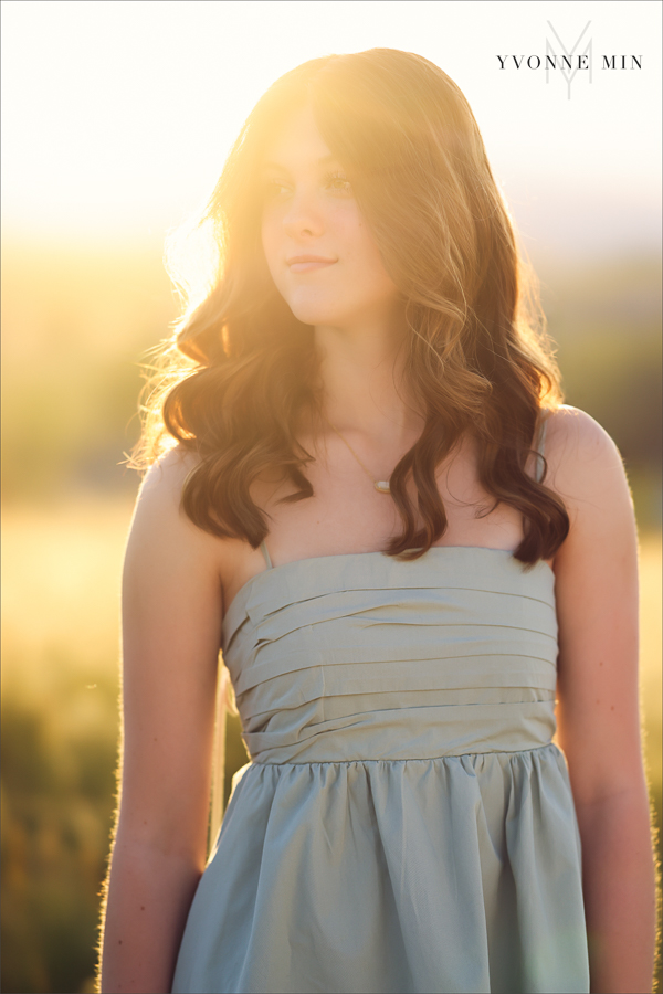 A Stargate High School senior girl poses for her senior pictures photoshoot at Purple Park, Superior, Colorado taken by Yvonne Min Photography.