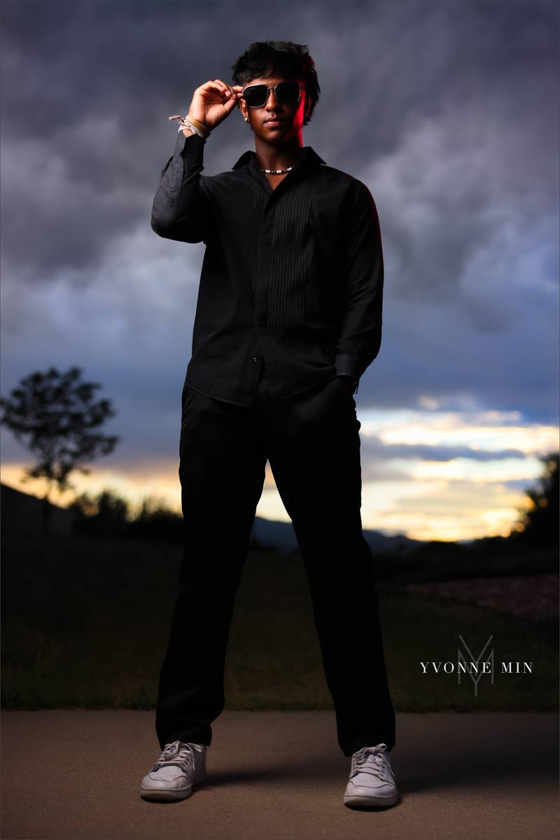 An OCF photograph of a high school senior boy from Stargate High School taken in Majestic Views Park, Arvada by Yvonne Min Photography that was featured on the Instagram page of Senior Luxe..