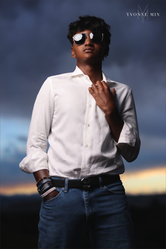 An OCF photograph of a high school senior boy from Stargate High School taken in Majestic Views Park, Arvada by Yvonne Min Photography.