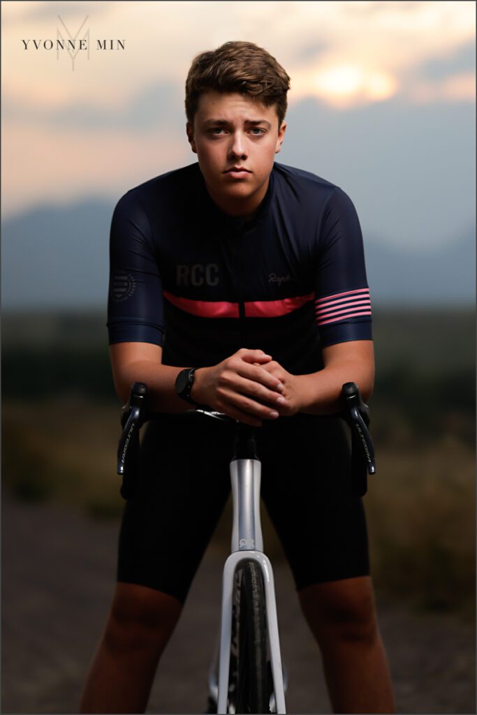 A senior picture of a Stargate High School boy sitting on a mountain bike in Purple Park, Superior, Colorado by Yvonne Min Photography.