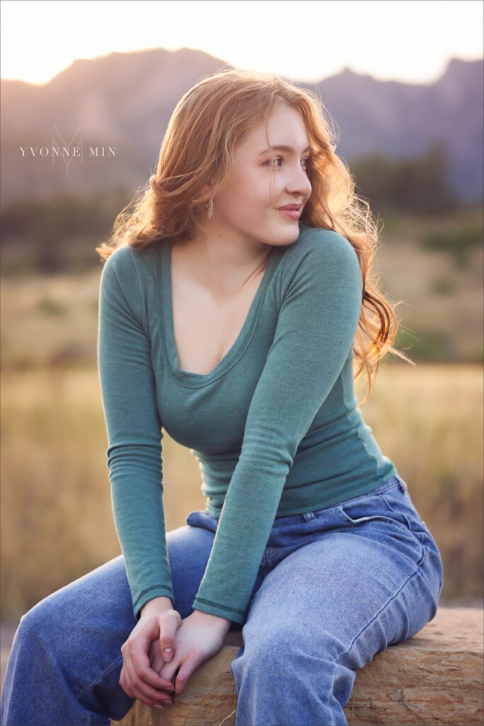 A sunset senior picture taken of a Stargate High school student with long red hair taken by Yvonne Min Photography at South Mesa.