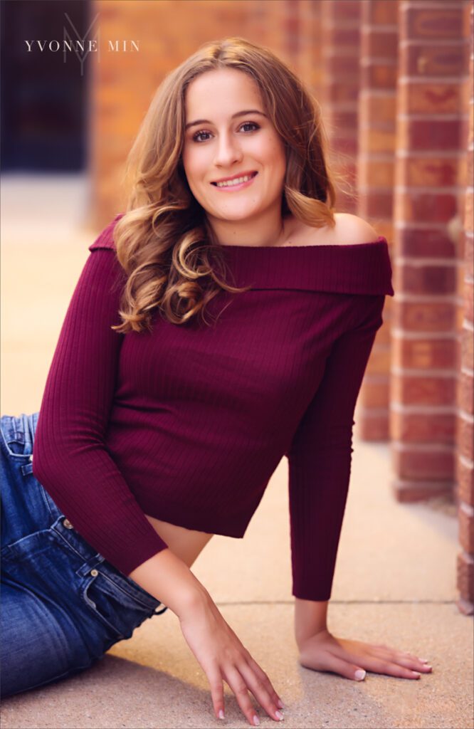 A high school senior picture of a student from Legacy High School posing with her moml in downtown Louisville, Colorado with Yvonne Min Photography.