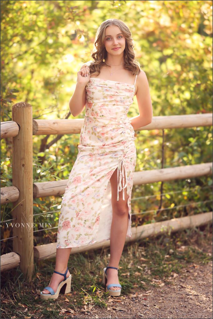 A high school senior girl from Jefferson Academy poses at her senior photoshoot at South Mesa Trailhead outside Boulder with Yvonne Min Photography.